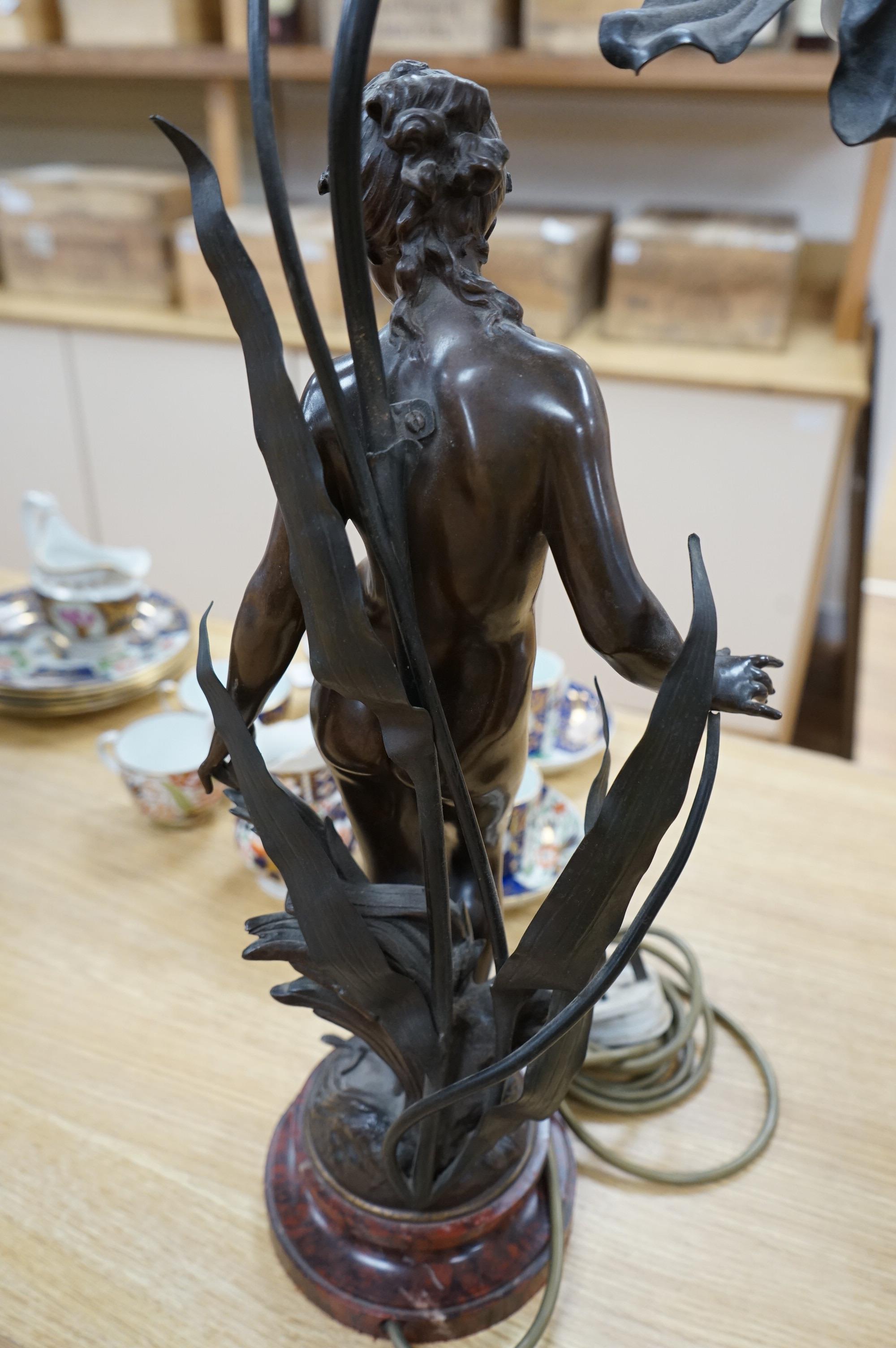 Auguste Moreau, a bronze figure of a nymph on a rouge marble base, later converted to a table lamp, 64cm high., Condition - good